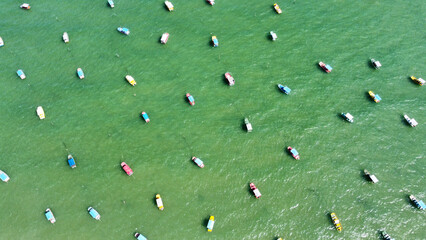 Fototapeta premium Colorful boats floating on the water in San Miguel de Milagres in Brazil.