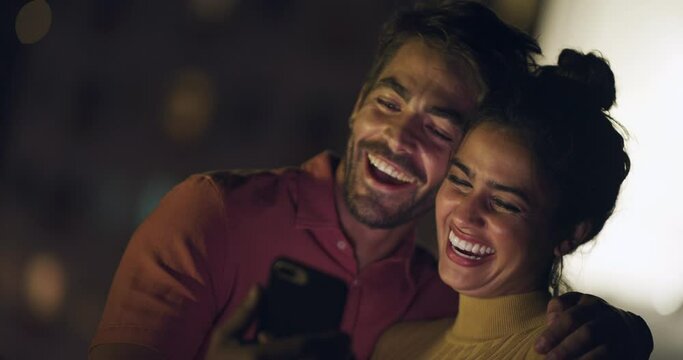 Night, phone and happy couple laughing, reading and check social media meme, blog story or online humour joke. Comedy, mobile app and city people with funny smartphone message, comic or communication