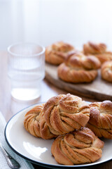Obraz na płótnie Canvas Traditional Swedish cardamom buns kardemummabullar made of yeast dough