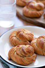 Traditional Swedish cardamom buns kardemummabullar made of yeast dough