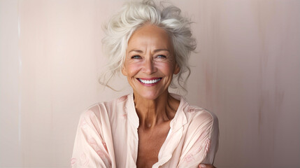 Portrait of very beautiful aged woman with grey hair sliming to camera. - obrazy, fototapety, plakaty