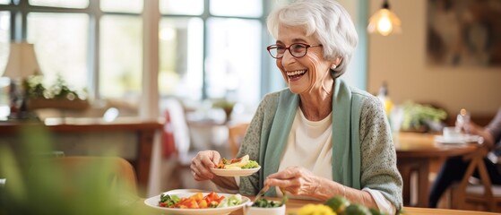 Elderly woman enjoying fresh salad at home. Healthy eating for seniors.