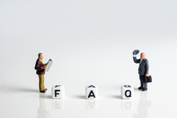 faq word or concept made by white letter cubes on white and gray background, frequently asked...