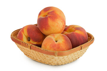 Ripe peach fruit in a wicker basket isolated on white background with full depth of field