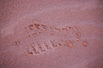 deep footprint in red sand