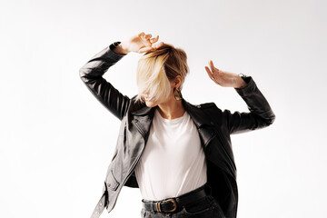 An energetic woman captured mid-dance, her leather jacket accenting the fluidity and freedom of her...