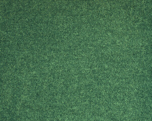 Texture of green knitted fabric as background.