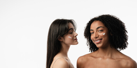 Female models of various ages celebrating their natural bodies in a studio.