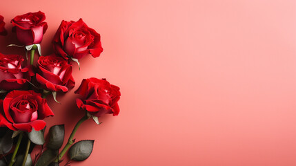 Serene top view of red roses carefully arranged on a pastel red backdrop, providing a delightful and visually appealing image with copyspace