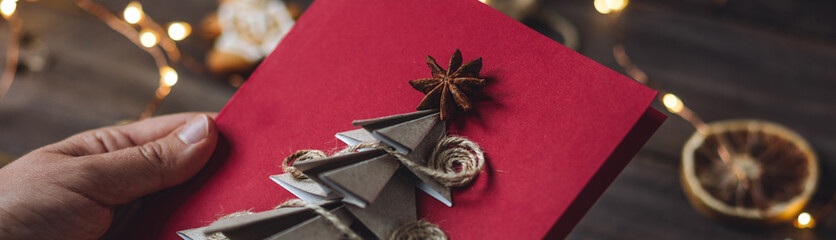 Craft handmade Christmas card with cute new year tree embroidering with wool thread. Made from...