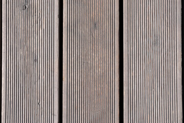 Dark wooden texture. Rustic three-dimensional wood texture. Modern wooden facing background. Wood background