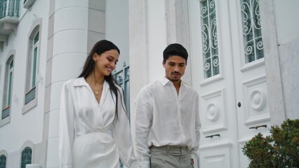 Romantic spouses walking city. Couple enjoying pleasant evening date strolling