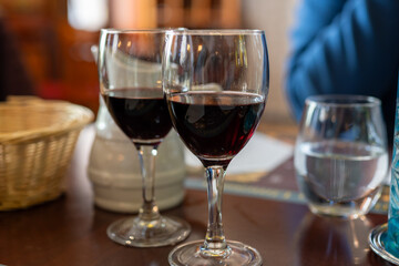 Red dry wine in glasses, lunch with wine in France,  Limouges, France
