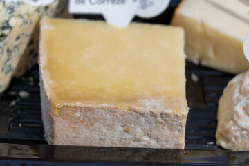 French cheeses collection, degustation plate, bleu de saint flour, pave de correse cow cheese,...