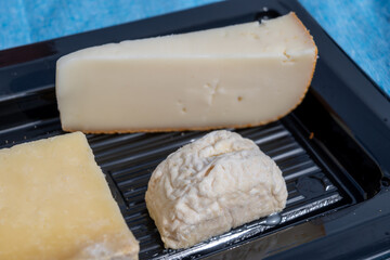 French cheeses collection, degustation plate, bleu de saint flour, pave de correse cow cheese, tomme de brebis sheep cheese, crottin de chevre goat cheese