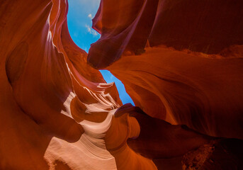 Abstract view of yellow orange red shadows and light at upper Antelope slot canyon with wave shape...