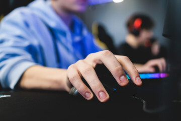 Cyber sport e-sports tournament, team of professional gamers, hands on a mouse and keyboard,...