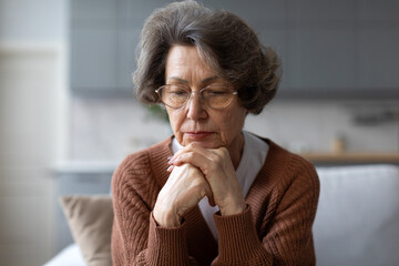 Unhappy depressed senior woman suffering from depression and loneliness, thinking about problems,...