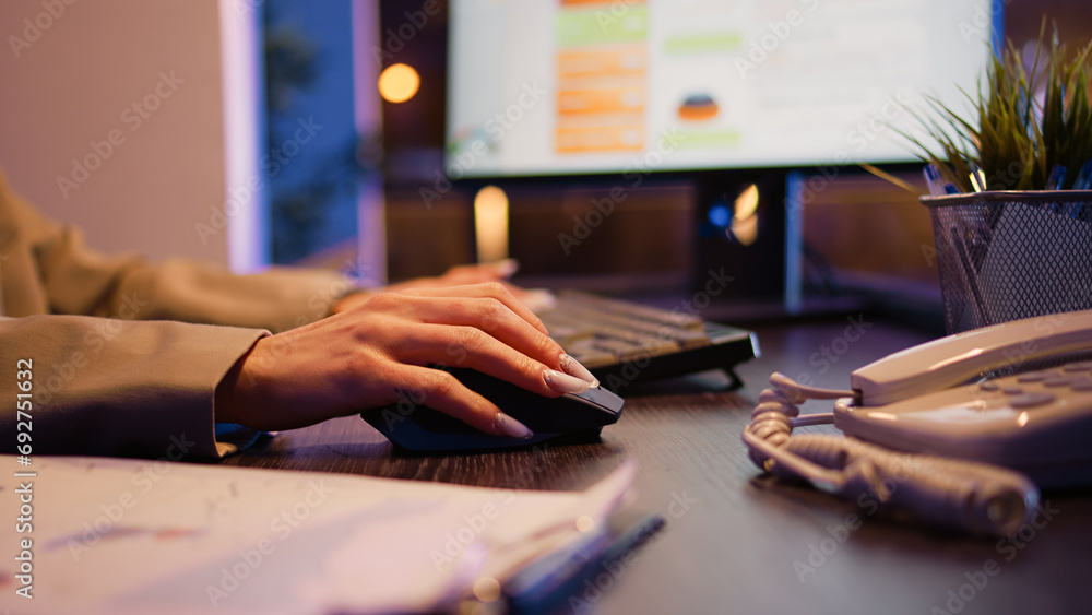 Poster office worker planning financial investment at night using computer before deadline. woman checking 