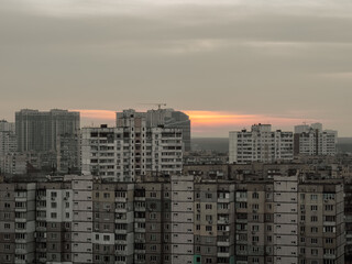 Fototapeta na wymiar Old Soviet high-rise buildings. Sunrise, sunset against the background of old high-rise buildings.