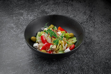 Caesar salad with croutons, cherry tomatoes, olives, cucumber and red onion