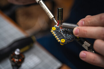 assembling fpv drones, assembly, soldering, high technologies. Close up view