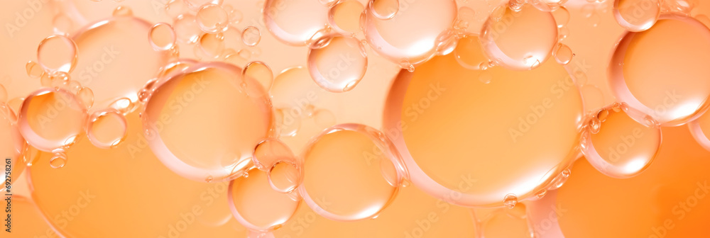 Poster a bunch of bubbles floating on top of each other. monochrome peach fuzz background.