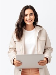 A woman holding a laptop computer in her hands.