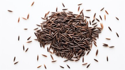 Black rice grains on a white background. Top view. Wild rice texture. Suitable for food and nutrition related content. Ideal for use in culinary and health-related designs.