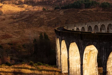 Zelfklevend behang Glenfinnanviaduct glenfinnan viaduc in the sunset 