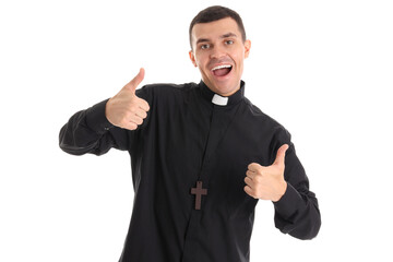 Young priest showing thumbs-up on white background