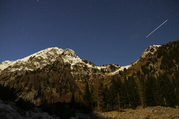 Satellite Star trail Over Winter Julian Alps Mountains, Krn Lake Slovenia
