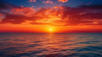 Naklejka na ściany i meble An image of vibrant sunset over the sea.