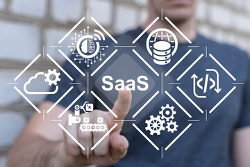 Man using virtual touch interface presses abbreviation: SaaS. Concept of SaaS - Software as a...