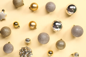 Different Christmas balls on yellow background