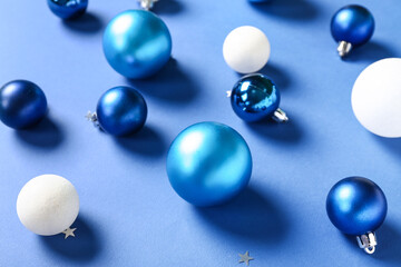 Different Christmas balls on blue background