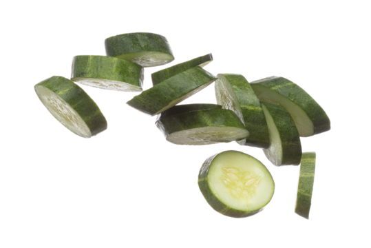 Cucumber fly fall, green fresh vegetable cucumber cut chop slice. Organic fresh vegetable with eaten leaf of long cucumber, close up texture. White background isolated freeze motion high speed shutter