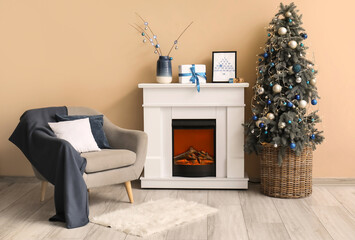 Interior of festive living room with cozy armchair, fireplace and traditional Hanukkah decorations