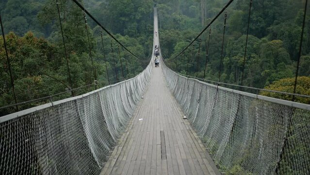 Situgunung longest cable suspension bridge at sukabumi, west java, Indonesia with group of people walking