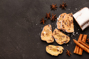 Composition with tasty Christmas stollen on black background