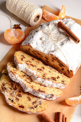 Composition with tasty Christmas stollen on white background