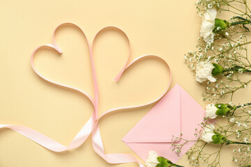 White carnations with gypsophila flowers, envelope with heart shaped ribbons on yellow background....