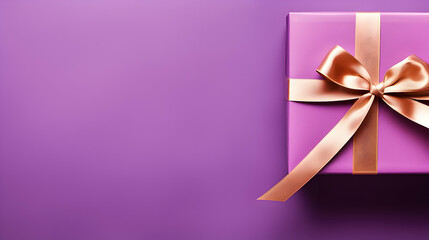 Purple gift box with beige ribbon on the purple background. Copy space. 