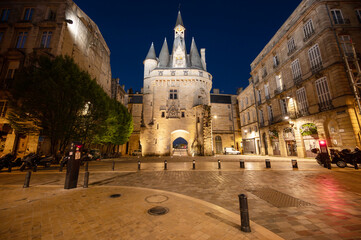 Night view of the Porte Cailhau or Porte du Palais. The former town gate of the city of Bordeaux in France. One of the main touristic attractions of the French city. High quality photography.