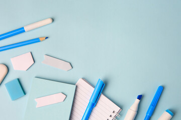 Different school stationery on light blue background, flat lay with space for text. Back to school