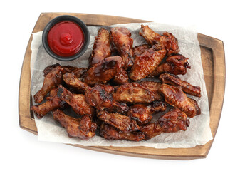 Tasty chicken wings and ketchup isolated on white, top view
