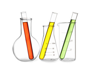 Glass flasks, beaker and test tubes with colorful liquids isolated on white