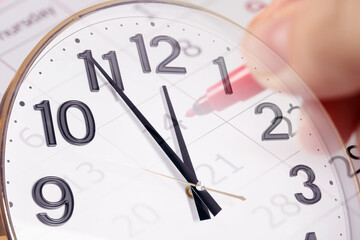Time concept. Double exposure of woman marking date in calendar and clock