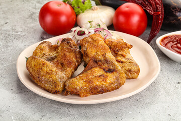 Grilled chicken wings with sauce