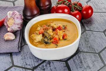 Traditional yellow Thai curry with chicken